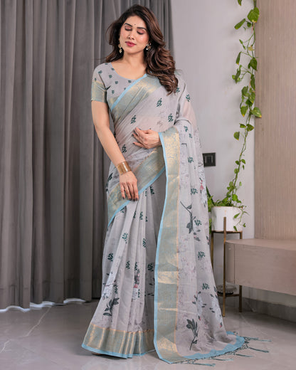 Elegant Ice Grey Handloom Linen Saree with Floral Print, Gold Zari Border & Tassel Detailing | Attached Blouse Piece | 5.5m Saree + 0.8m Blouse
