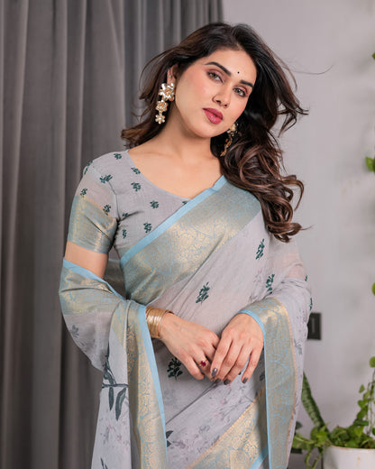 Elegant Ice Grey Handloom Linen Saree with Floral Print, Gold Zari Border & Tassel Detailing | Attached Blouse Piece | 5.5m Saree + 0.8m Blouse