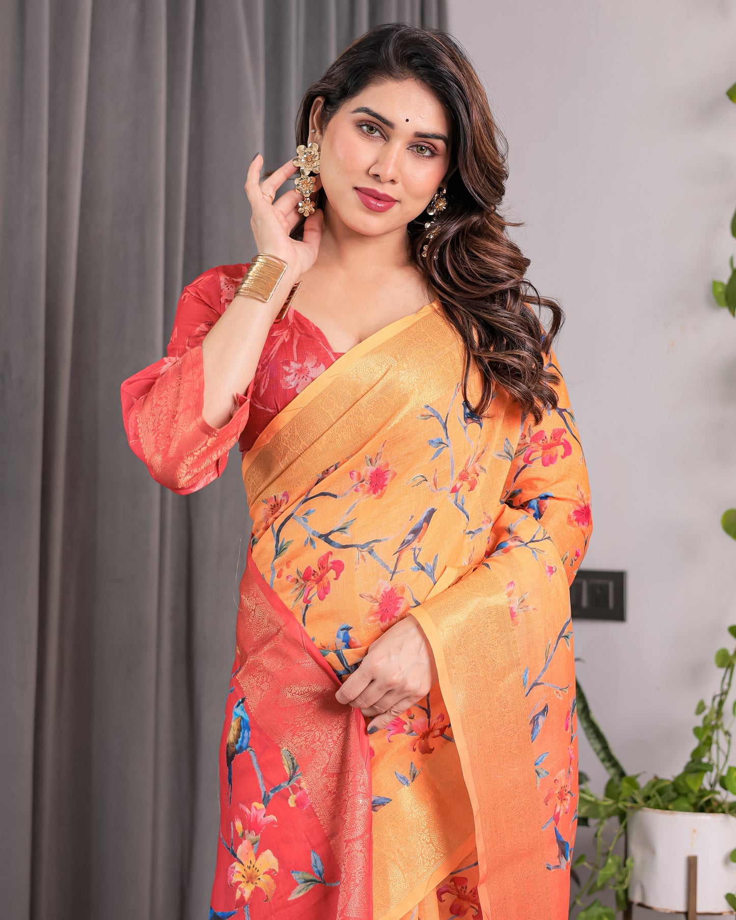 Sunset Orange Handloom Linen Saree with Bluebird & Floral Digital Print | Contrasting Red Pallu & Gold Zari Border | Tassel Detailing | Attached Blouse | 5.5m Saree + 0.8m Blouse