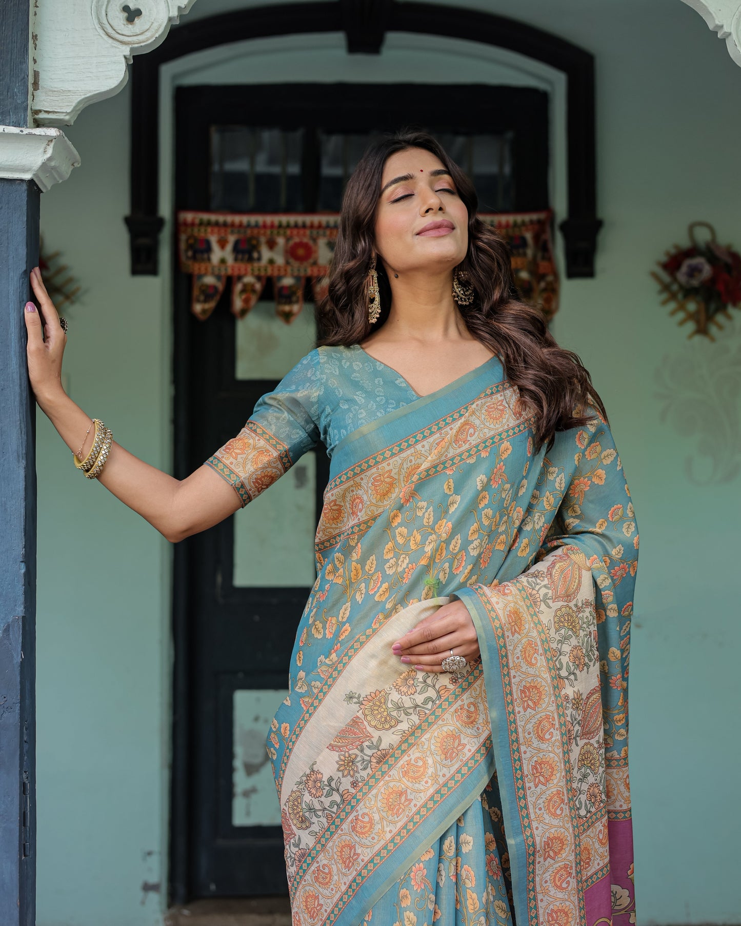 Turquoise Blue Handloom Cotton Saree with Multicolor Floral Pallu & Peach Border