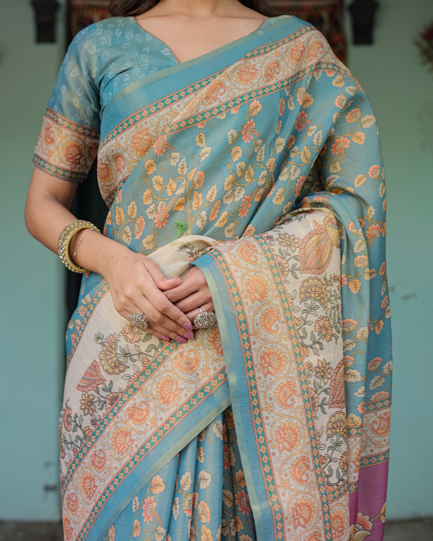 Turquoise Blue Handloom Cotton Saree with Multicolor Floral Pallu & Peach Border